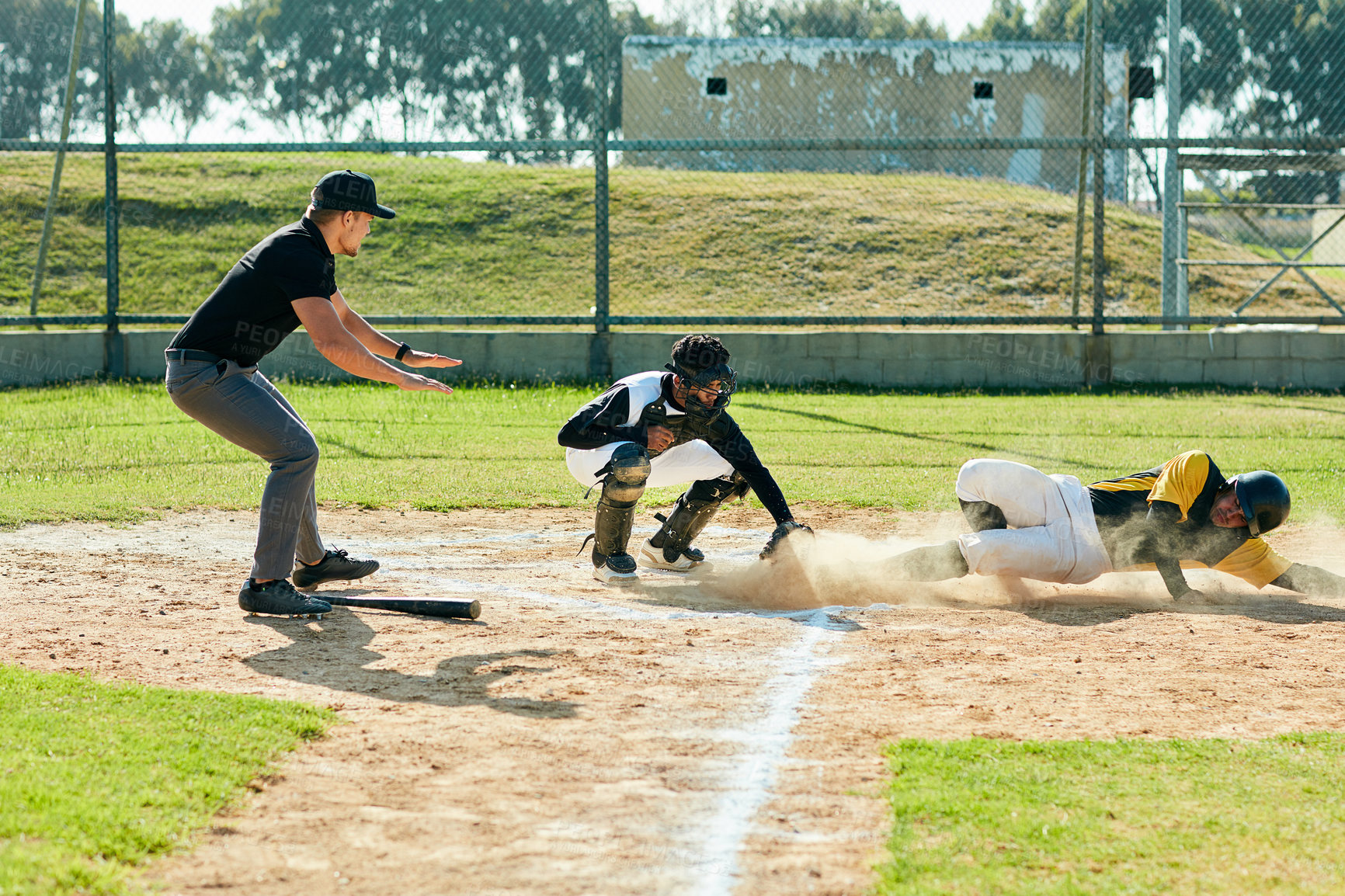 Buy stock photo Men, baseball or runner with pitch for point, sports or match in tournament or outdoor game. Young, male people or players with dust in competition for ball, score or safe on grass field or dirt turf