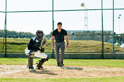 Buy stock photo Full length shot of a young baseball player waiting to catch a ball during a match on the field