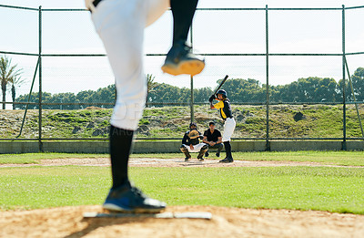 Buy stock photo Cropped shot of a young baseball player batting a ball during a match on the field