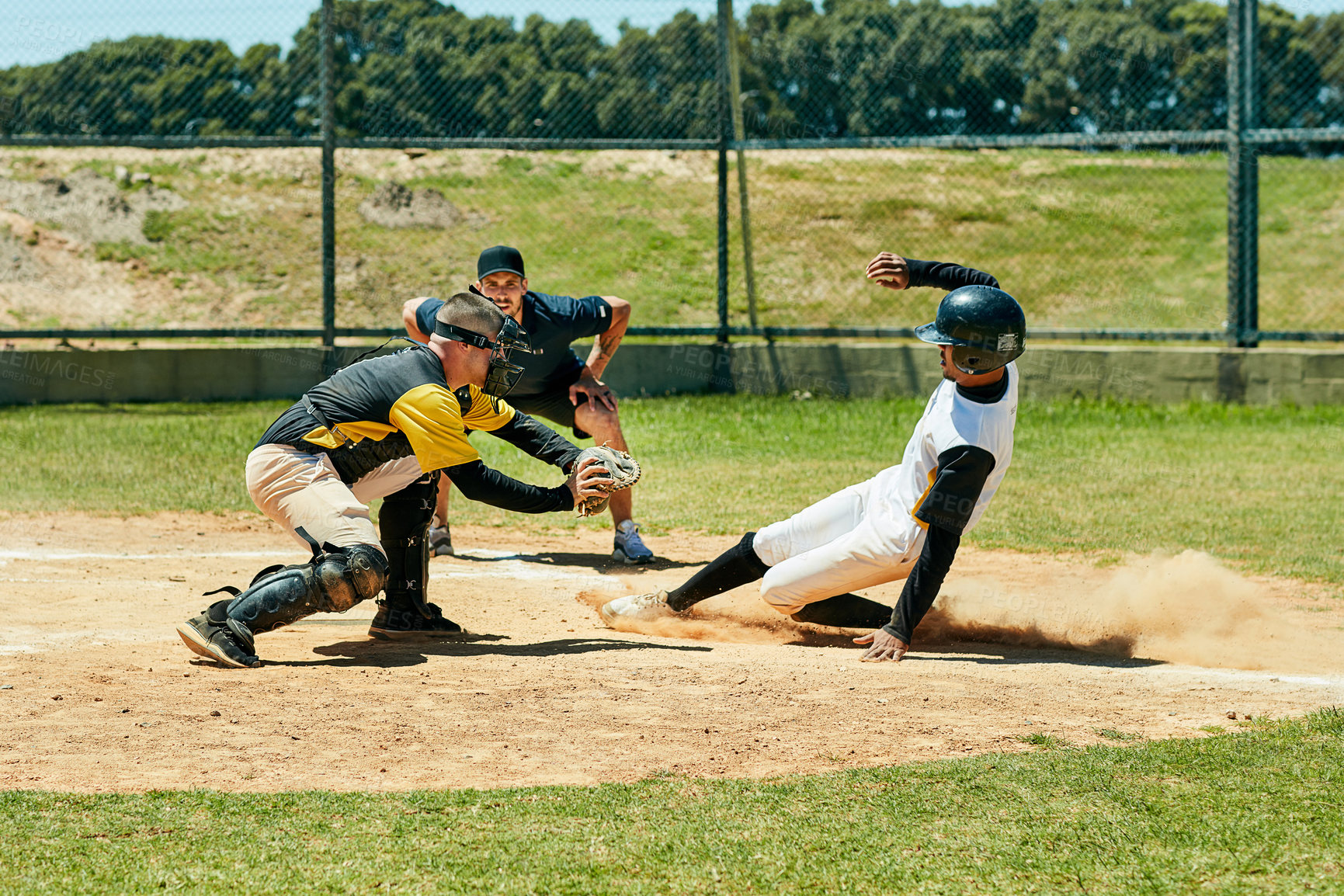 Buy stock photo Baseball, people and slide on field at base for run, score and intense match in summer. Team sport, energy and dirt in game for training, homerun and achievement in Texas stadium for tournament