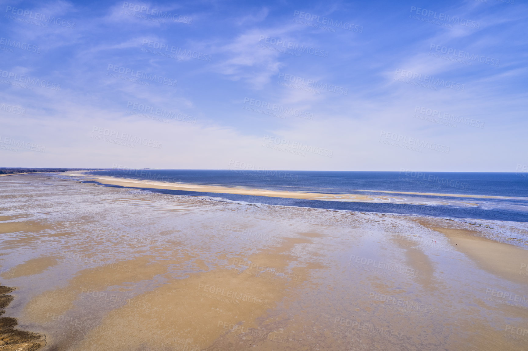 Buy stock photo Copyspace at the beach with a blue sky background above the horizon. Calm ocean waves across an empty sea along the sandy shore. Tranquil landscape for a relaxing and zen summer holiday in Denmark