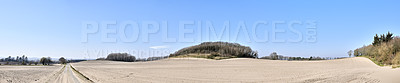 Buy stock photo Landscape of sandy farmland close to the beach on the East Coast of Jutland. Spring and summer is the best time vacation in Denmark to enjoy peace and quiet in nature. Natural sand dunes in Europe.