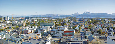 Buy stock photo Scenic landscape of the city of Bodo in Nordland, Norway with lush surroundings, panoramic mountain and clear sky background with copyspace. Peaceful coastal suburb with breathtaking views