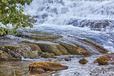 Buy stock photo Mountain stream and waterfall rushing down over rocks and boulders. Beautiful nature landscape natural, fresh river flows between trees in an eco environment in Norway. Scenery on adventure walks