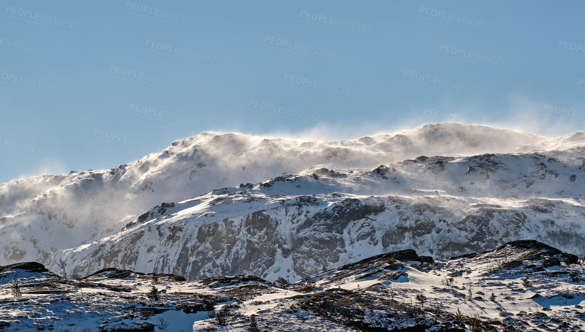 Buy stock photo Scenic panoramic of snow capped mountain landscape in Bodo, Nordland, Norway against a clear blue sky background. Breathtaking and picturesque view of a cold and icy natural environment in winter