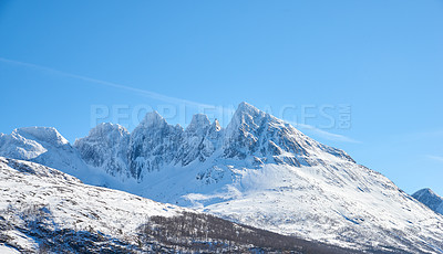 Buy stock photo Landscape view of snow mountains and glacier ice after a heavy, arctic, winter snowstorm in Norway. Blue sky, copy space of vast mountainous landscape ideal for extreme sport in winter