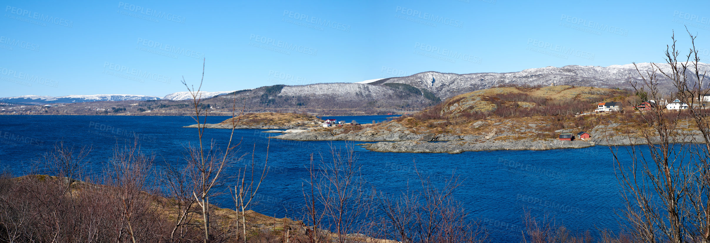 Buy stock photo The city of Bodo and its surroundings during the day in summer. Landscape view of a lake against a blue sky in the countryside. Peaceful and quiet vacation destination in a rustic natural environment