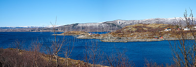 Buy stock photo The city of Bodo and its surroundings during the day in summer. Landscape view of a lake against a blue sky in the countryside. Peaceful and quiet vacation destination in a rustic natural environment