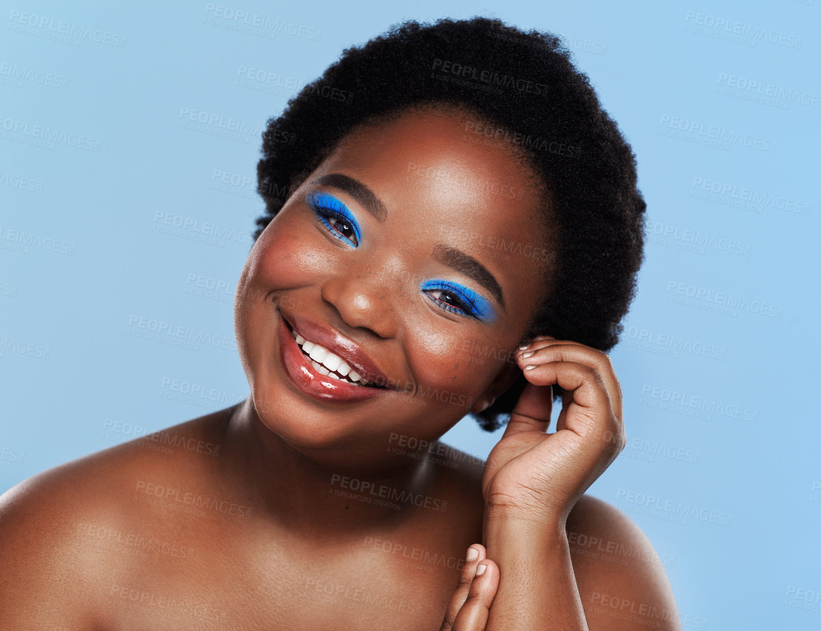 Buy stock photo Makeup, black woman and portrait in studio, beauty and eyeshadow on blue background. Cosmetic, confidence and eyeliner for glamour and female person, smile and skincare for glow and luxury treatment