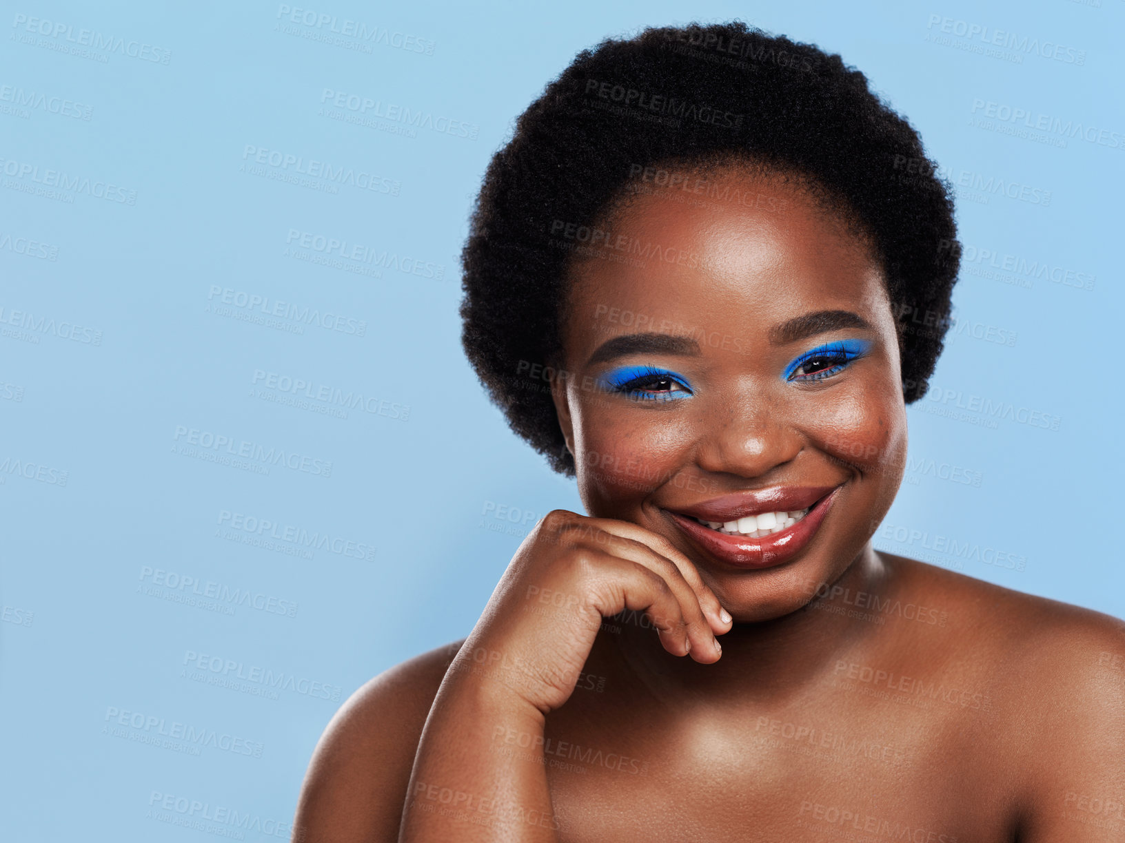 Buy stock photo Portrait, skincare and black woman with makeup, beauty and eyeshadow on blue studio background. African person, face and model with cosmetology, dermatology or bold with shine, wellness and color