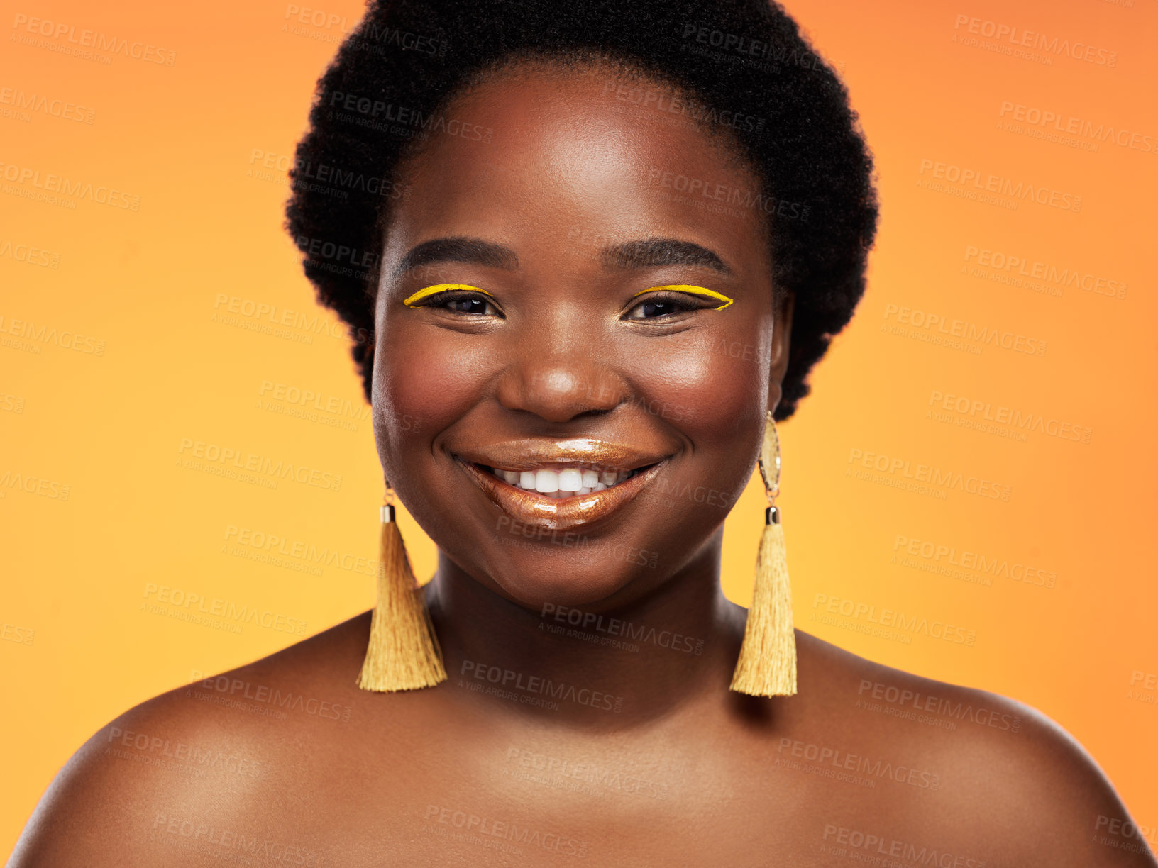 Buy stock photo Studio shot of a beautiful young woman posing against an orange background