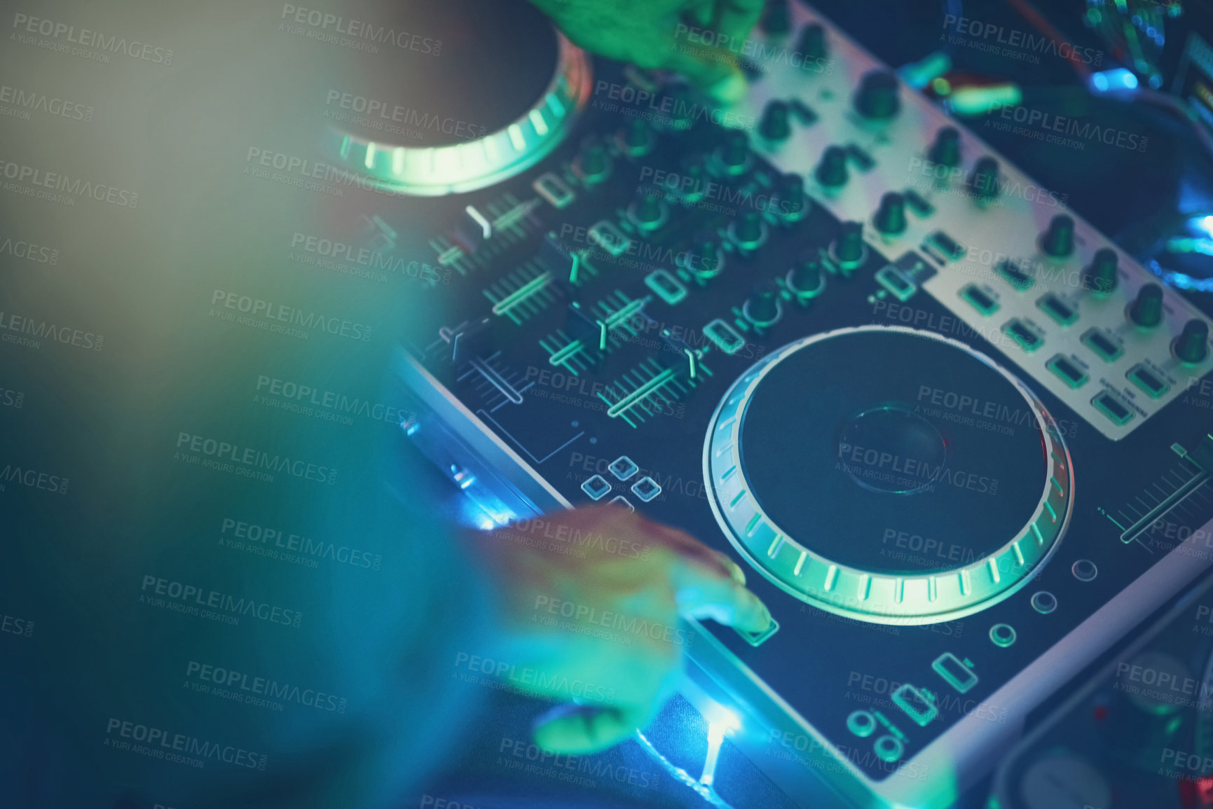 Buy stock photo Shot of an unidentifiable DJ making music in a nightclub