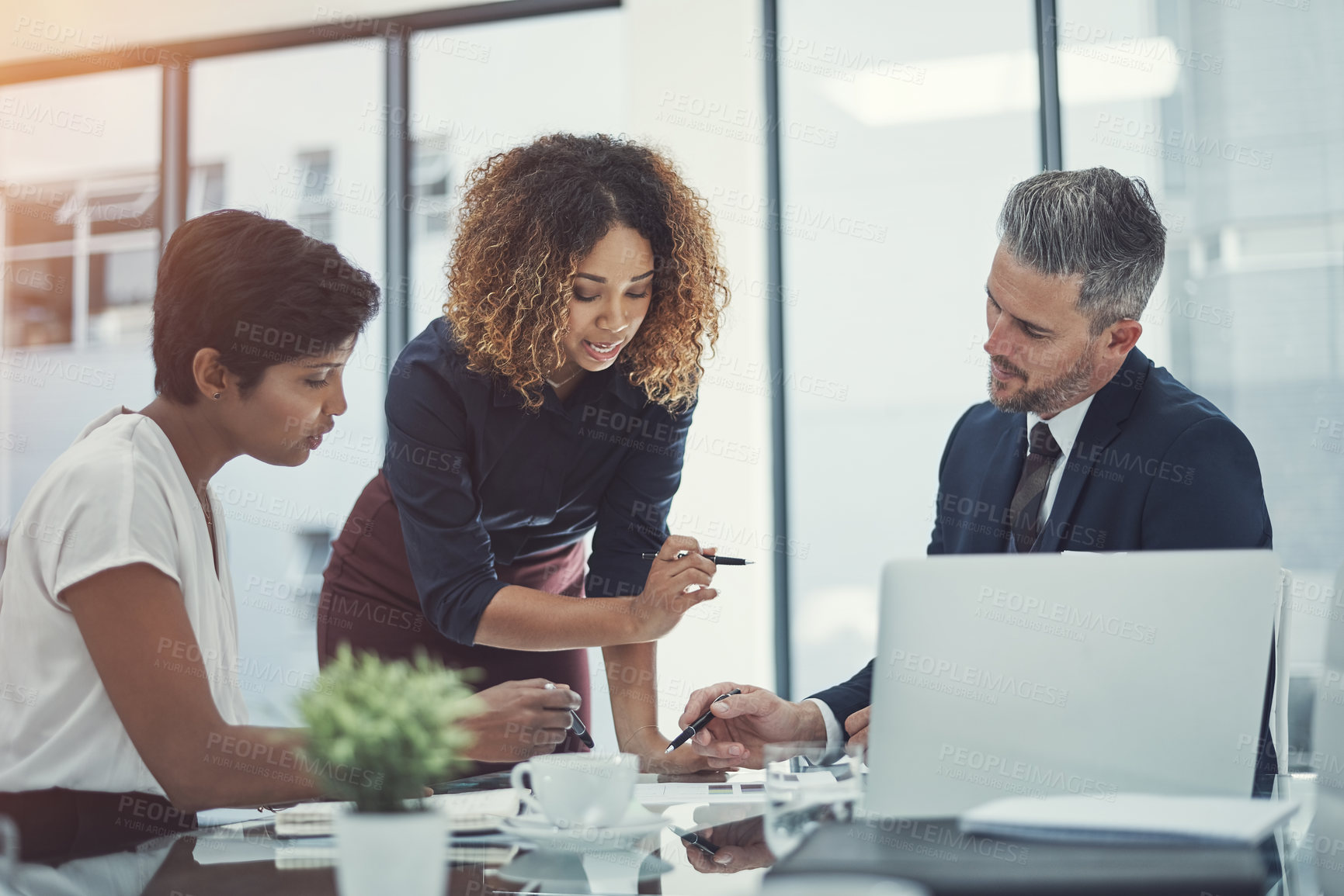 Buy stock photo Shot of a group of businesspeople having a meeting in the boardroom