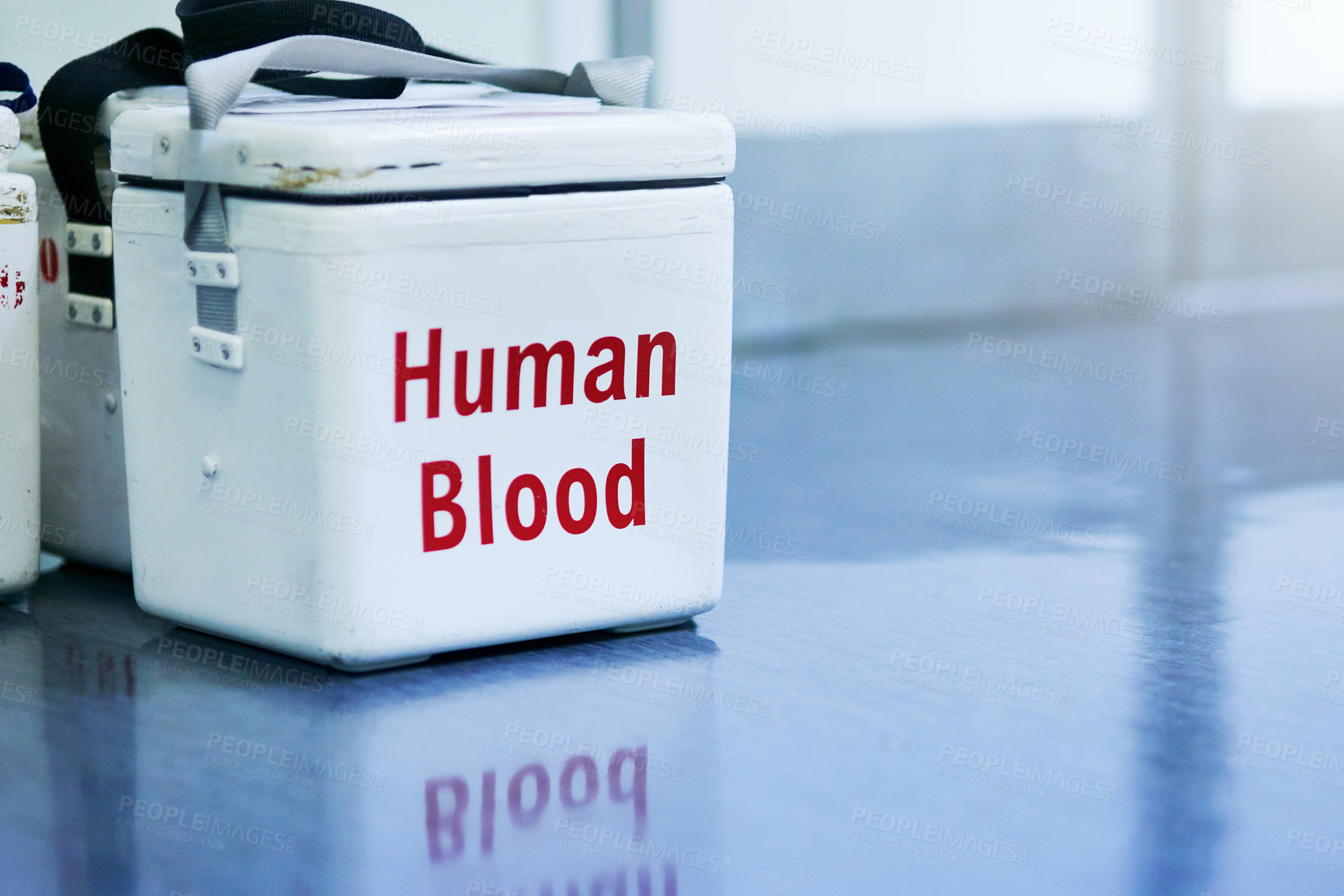 Buy stock photo Shot of a box containing blood samples on a hospital floor