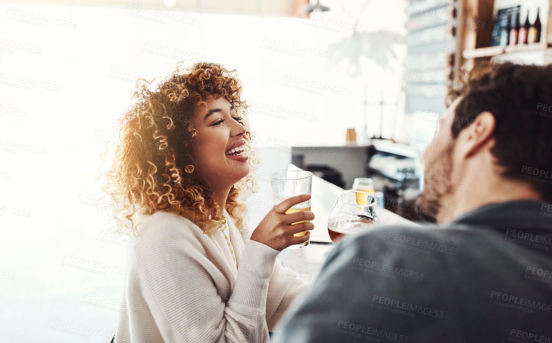 Buy stock photo Date, couple and restaurant with drink, laughing and happy from romance and talking. Pub, smile and people with conversation, love and bonding with beer and alcohol with funny joke on anniversary