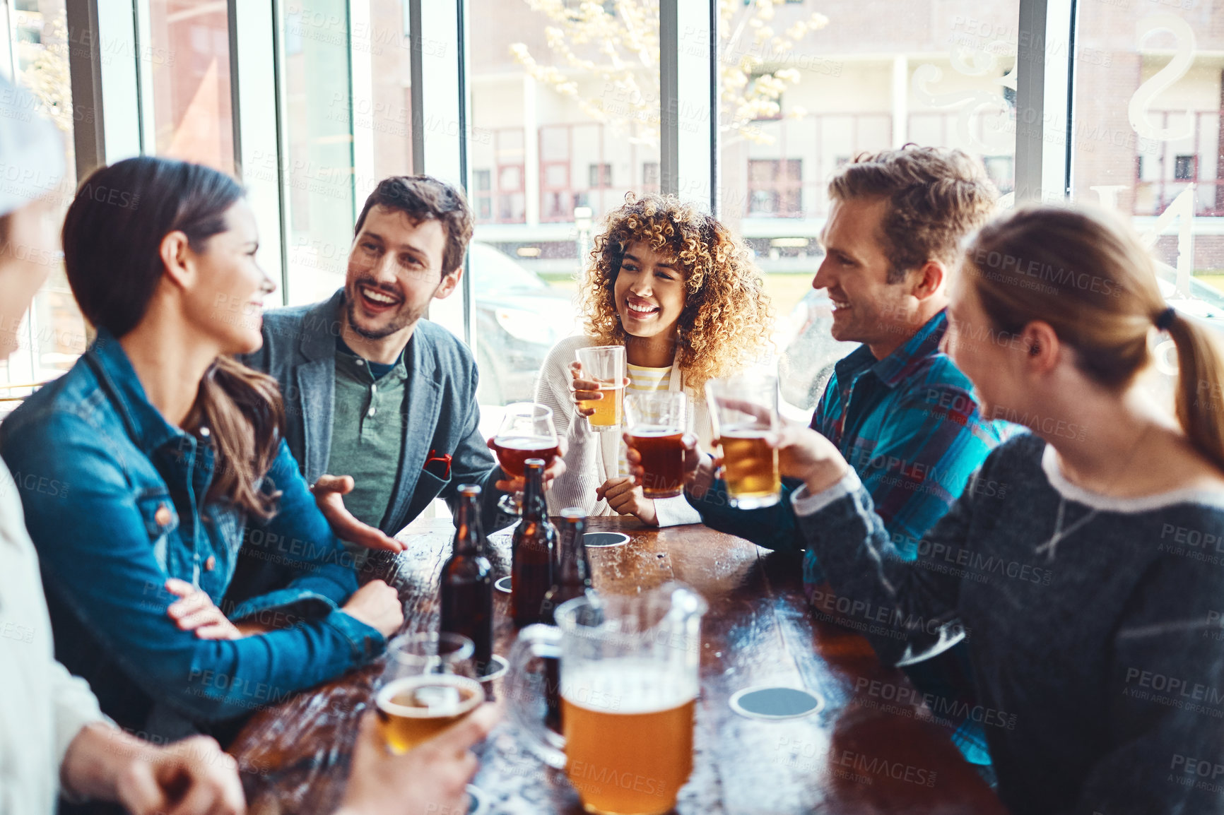 Buy stock photo Bar, group and conversation for fun, beer and party of joy, gathering or celebration of friends in event. Table, alcohol or drinks to enjoy, glass and people in club, break or together in Los Angeles