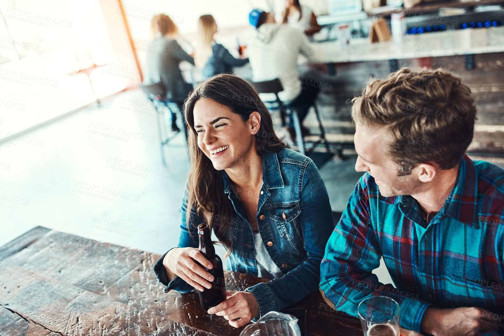 Buy stock photo Friends, beer and celebration in restaurant, social gathering and students with happiness, bonding together and relax. Cheerful, people and man with woman, alcohol and laughing with drinks and humor