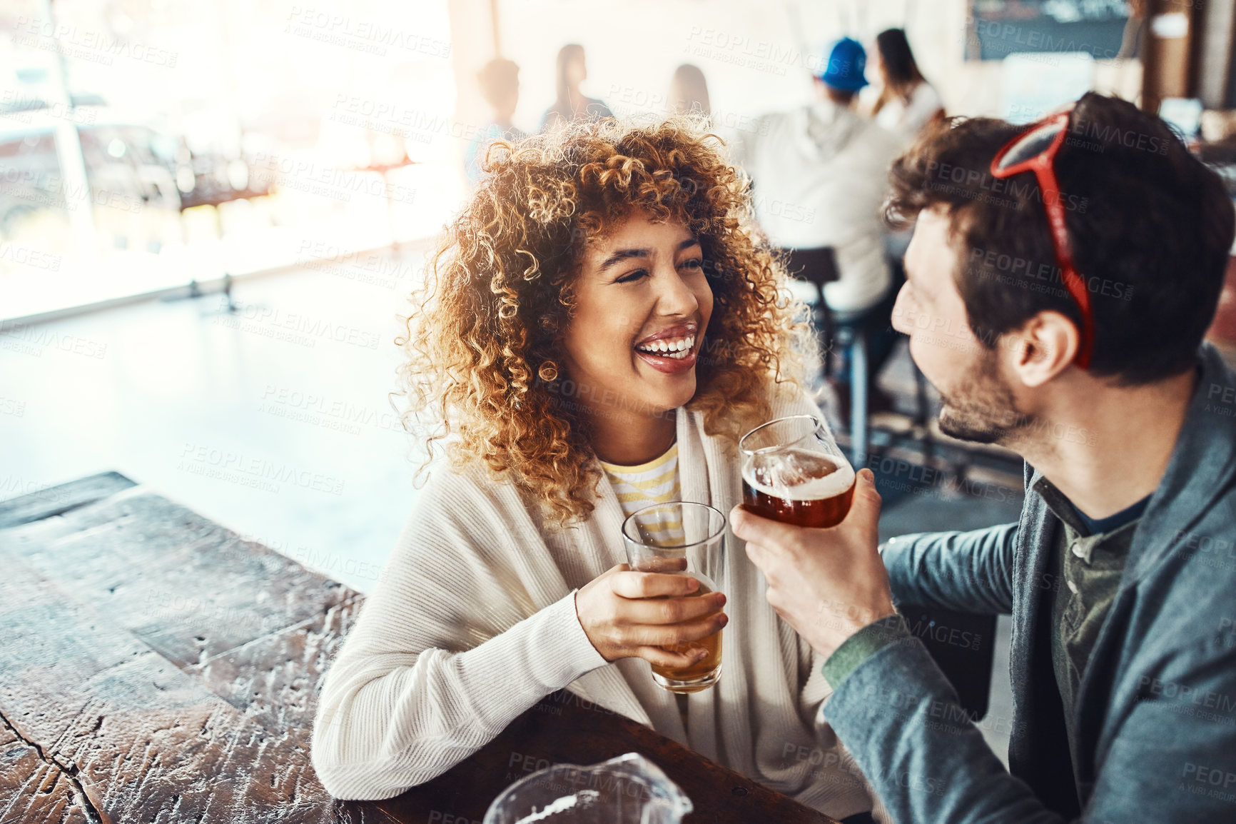 Buy stock photo Couple, beer and celebration with happiness, students and social gathering with happiness, bonding together and relax. Friends, people and man with woman, alcohol and humor with drinks and laughing
