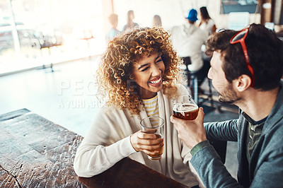 Buy stock photo Friends, beer and celebration in restaurant, chilling and students with happiness, drinks and cheerful. Conversation, people and man with woman, alcohol and social gathering with drinks and romance