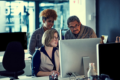 Buy stock photo Shot of a group of businesspeople working late in an office