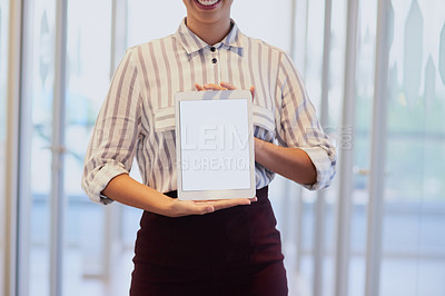 Buy stock photo Closeup shot of an unrecognizable businesswoman holding up a digital tablet with a blank screen in an office