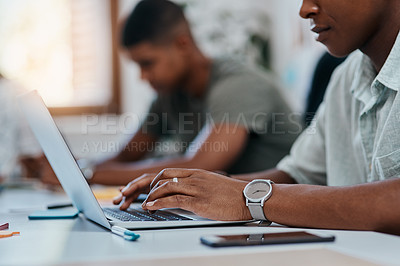 Buy stock photo Cropped shot of a businessman using a computer in a modern office