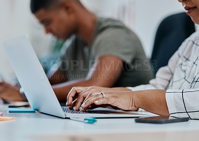 Buy stock photo Cropped shot of a businesswoman using a computer in a modern office