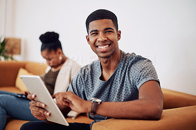 Buy stock photo Man, tablet and portrait on sofa in office for reading email, research and review feedback of project proposal. Male person, digital and web design for communication, schedule and startup development