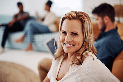 Buy stock photo Cropped portrait of an attractive young businesswoman sitting with a male colleague in the office