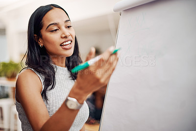 Buy stock photo Cropped shot of an attractive young businesswoman using a visual aid to brainstorm ideas in the office