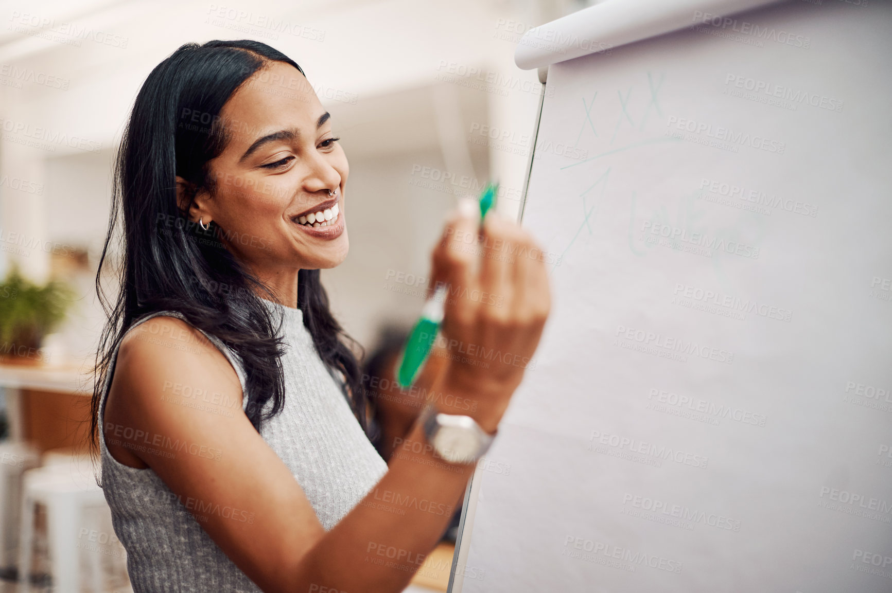 Buy stock photo Cropped shot of an attractive young businesswoman using a visual aid to brainstorm ideas in the office