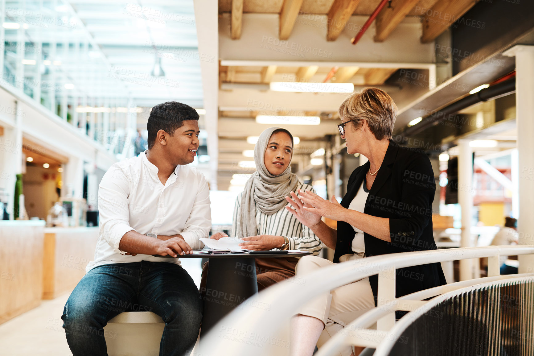 Buy stock photo Shot of a group of businesspeople having a discussion in an office