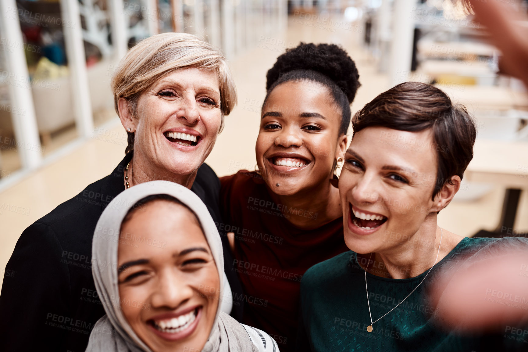 Buy stock photo Portrait of a group of businesswomen taking selfies together in an office