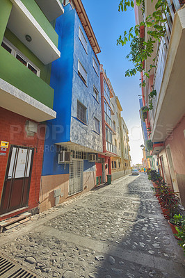 Buy stock photo Historical city street view of residential houses in small and narrow alley or road in tropical Santa Cruz, La Palma, Spain. Village view of vibrant buildings in popular tourism destinations overseas