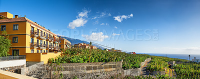 Buy stock photo View of residential houses and apartments in historical and tropical city in Los Llanos, La Palma, Canary Islands with blue sky background. Vibrant buildings in village of popular tourism destination