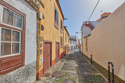 Buy stock photo Historical city street view of residential houses in small and narrow alley or road in tropical Santa Cruz, La Palma, Spain. Village view of vibrant buildings in popular tourism destinations overseas