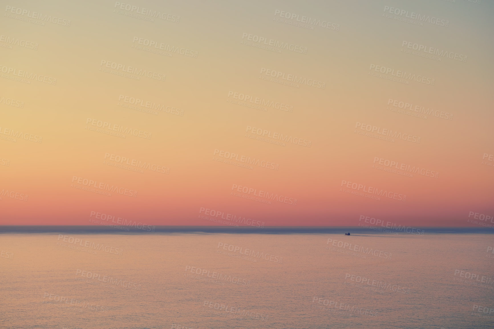 Buy stock photo Seascape of a beautiful golden sunset with copy space. Sun setting on the horizon of a calm ocean at dusk or twilight. The calm and tranquil ocean or sea in the evening with bright sky copyspace