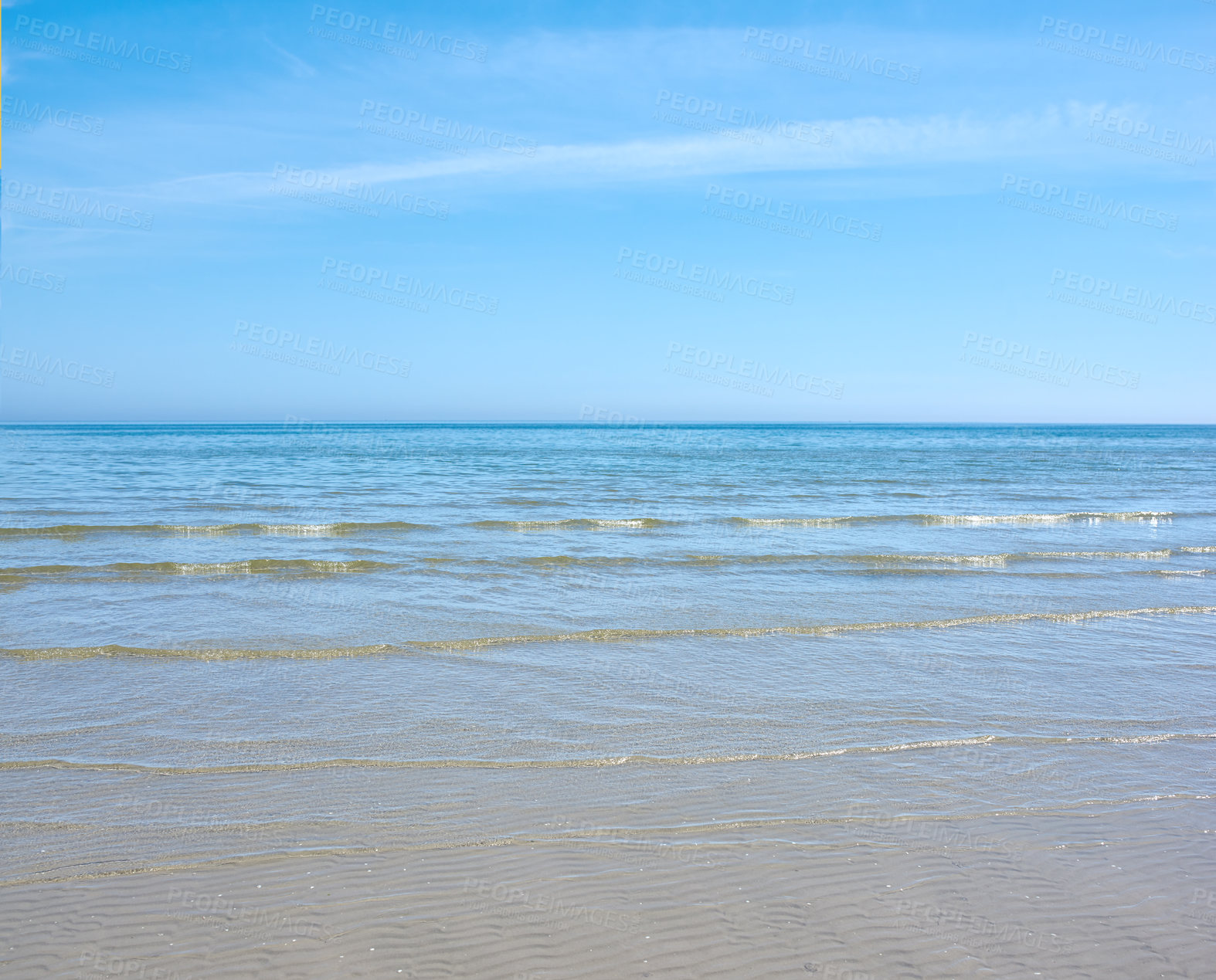 Buy stock photo Sea and ocean view of waves washing onto an empty and relaxing tropical beach on a warm, summer day. Seascape with clear blue sky and copy space of calm water on a remote and secluded island