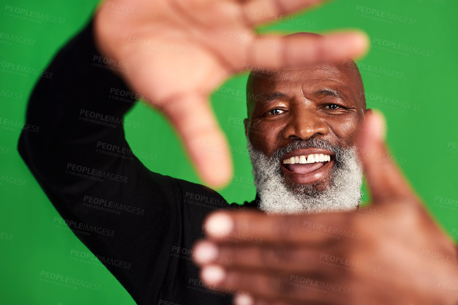 Buy stock photo Studio shot of a senior man forming a finger frame in front of his face
