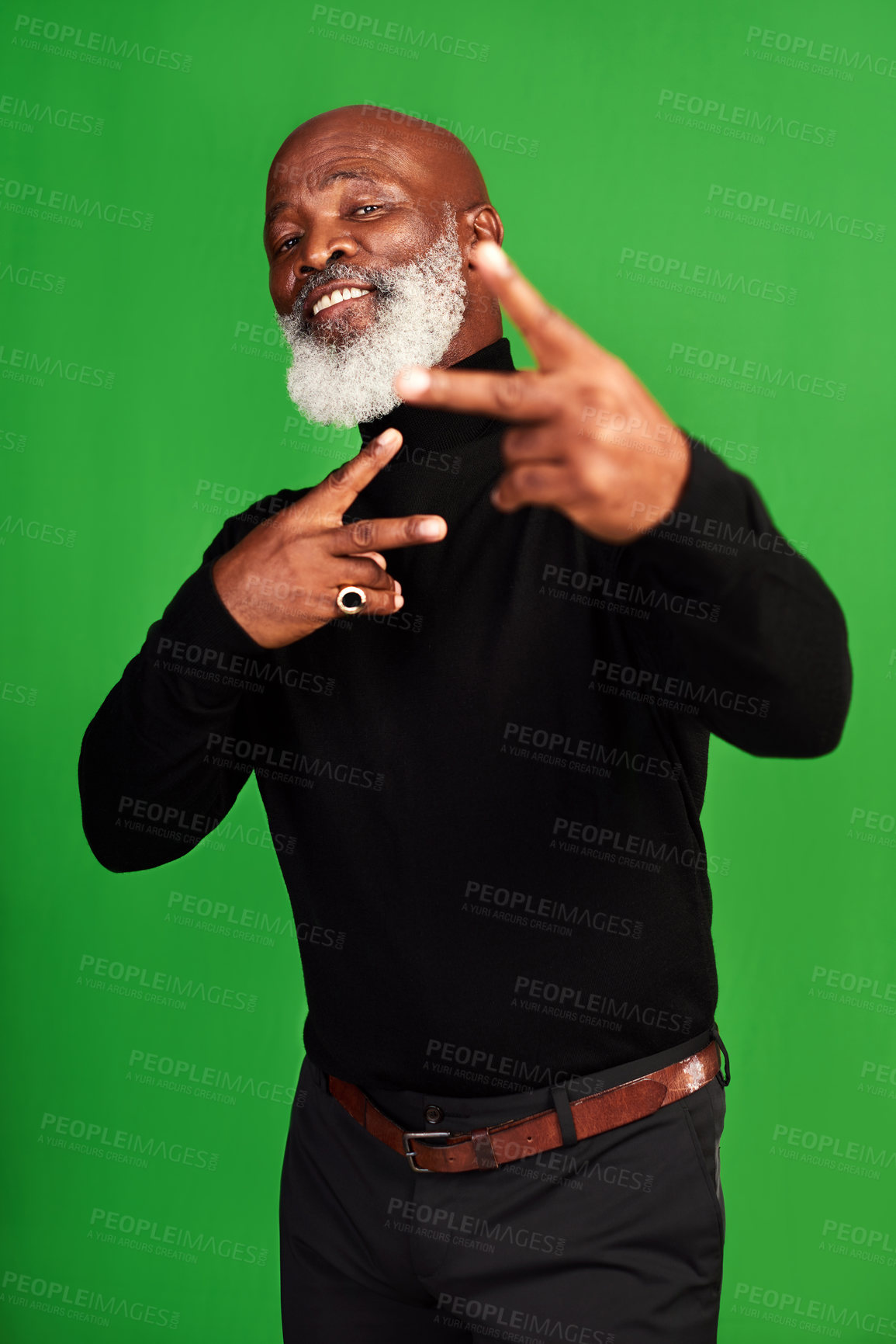 Buy stock photo Studio shot of a senior man showing peace signs while posing against a green background