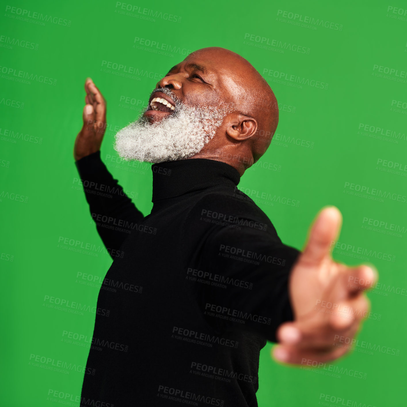 Buy stock photo Studio shot of a senior man posing against a green background
