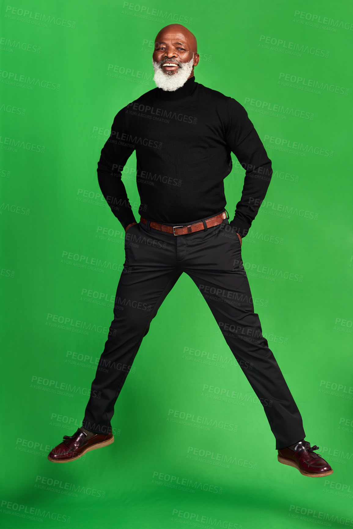Buy stock photo Studio shot of a senior man posing against a green background