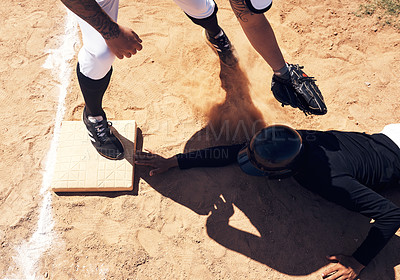 Buy stock photo Shot of a young man reaching base during a baseball match