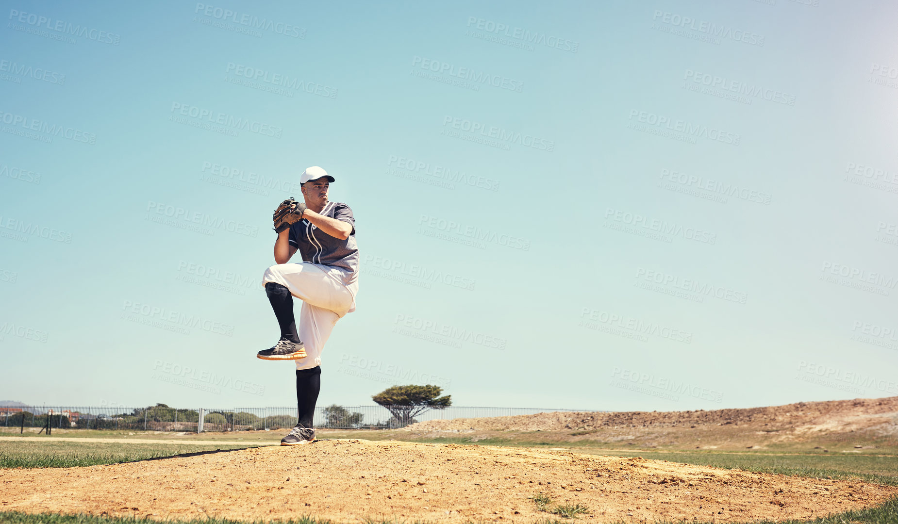Buy stock photo Games, sports and baseball with man on field for competition, training or performance. Action, exercise and championship with male athlete throwing in stadium park for fitness, pitch and mockup space
