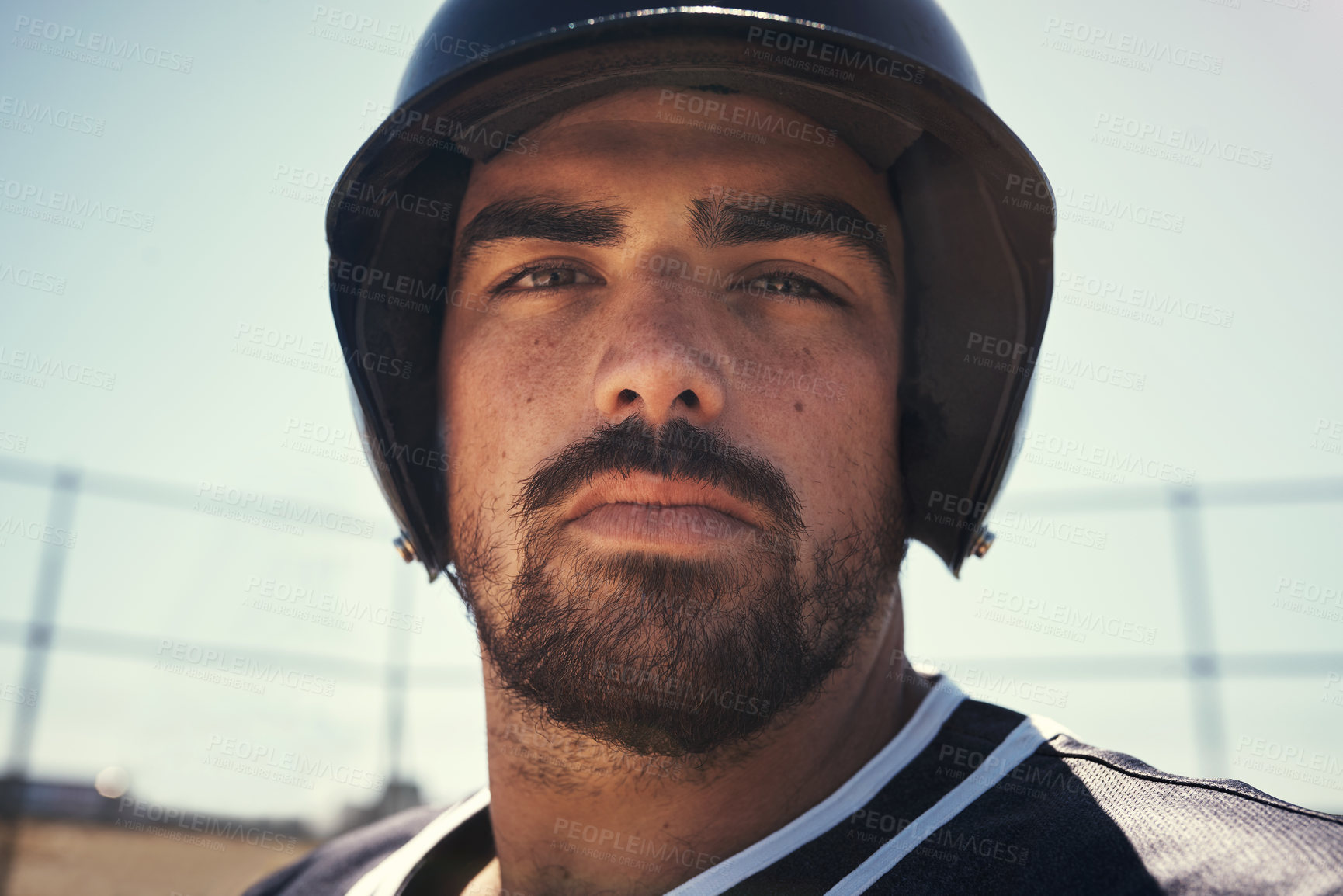 Buy stock photo Portrait of a young man playing a game of baseball