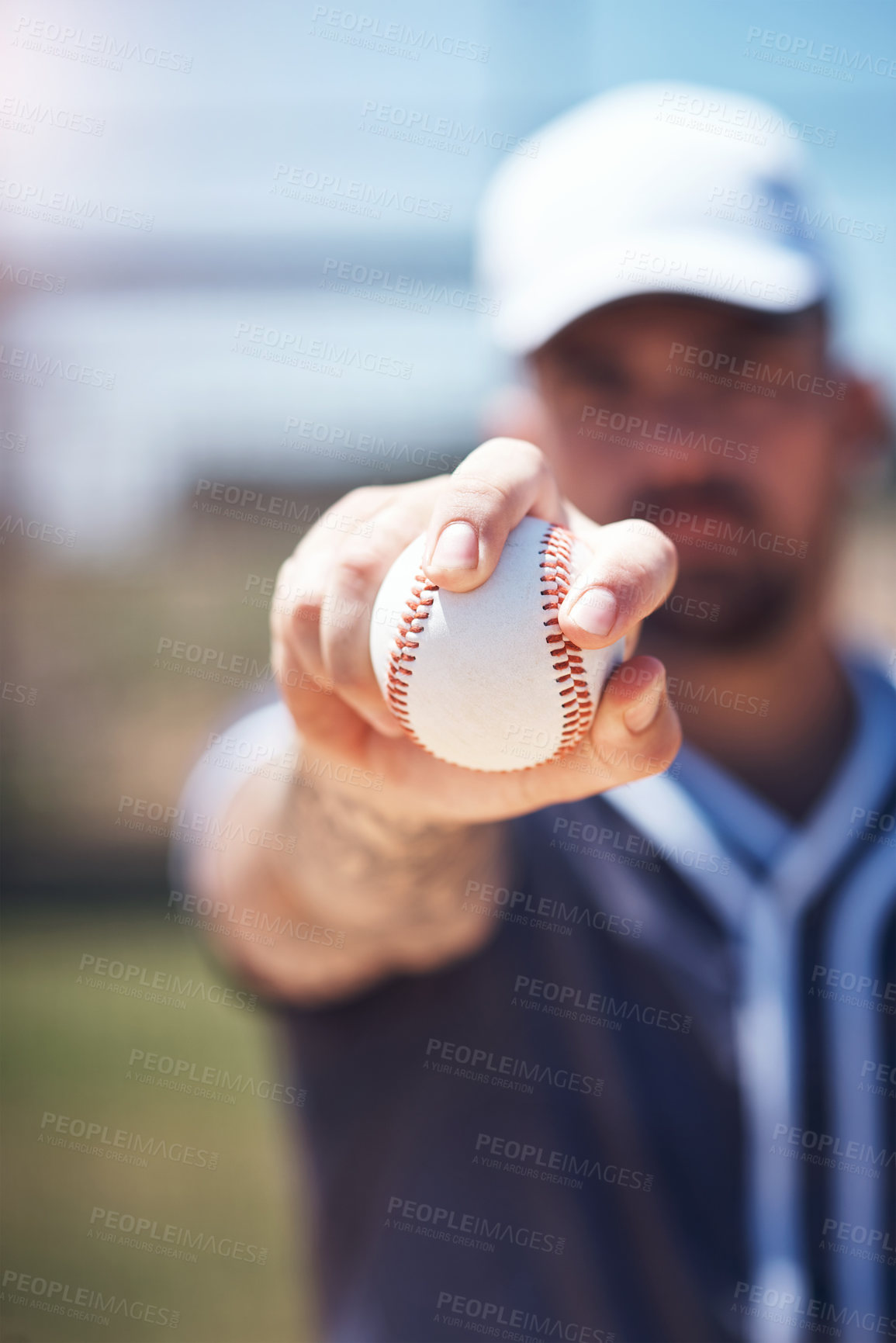 Buy stock photo Hand holding baseball, closeup and man for sports, field and training with blurred background in sunshine. Softball player, sport and zoom of ball for training, fitness and workout for competition