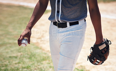 Buy stock photo Cropped shot of a man standing on a field and holding a baseball mitt and ball at a match