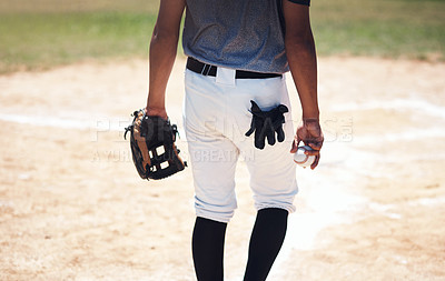 Buy stock photo Cropped shot of a man standing on a field and holding a baseball mitt and ball at a match