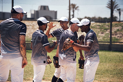 Buy stock photo Shot of a group of young baseball players celebrating after playing a game