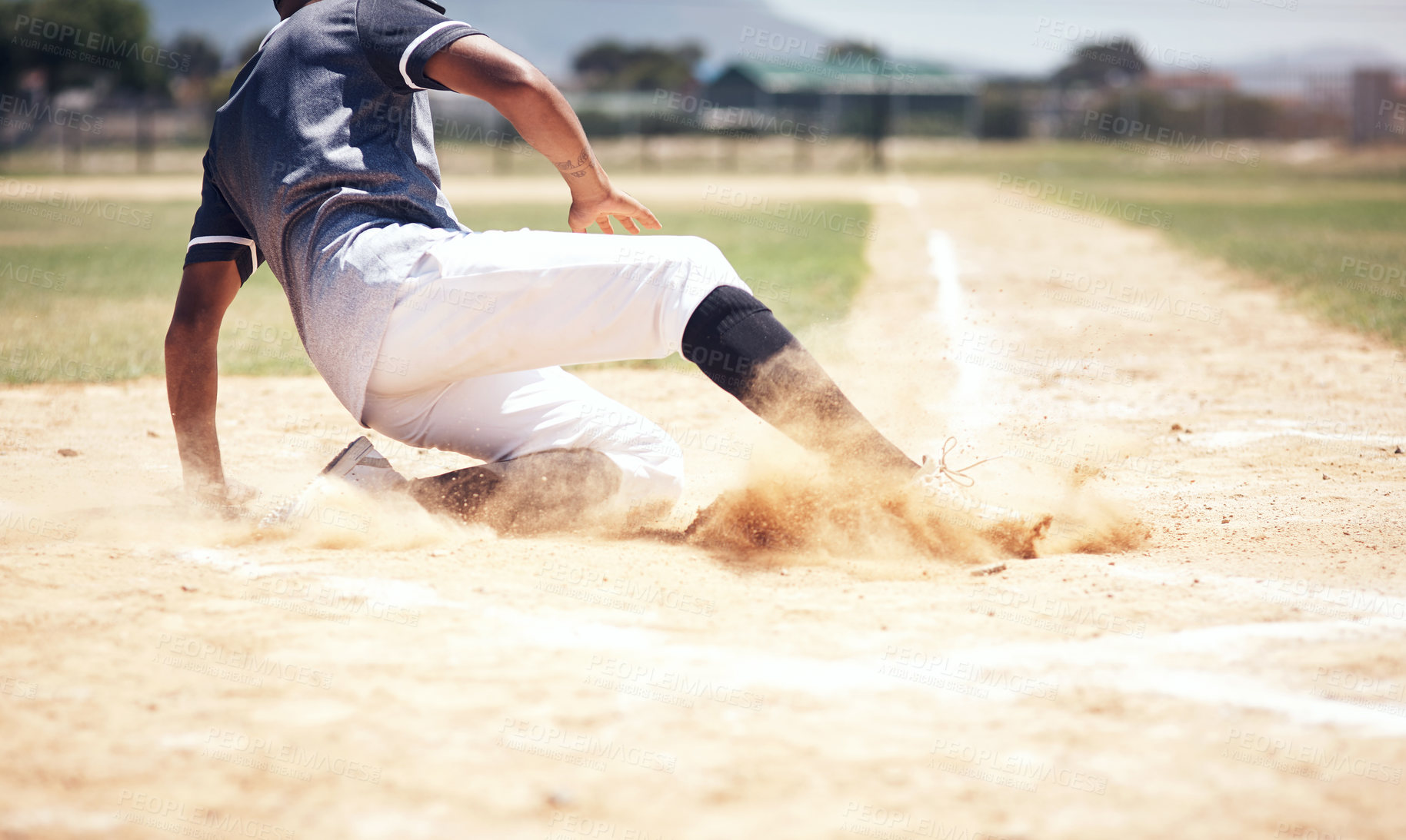 Buy stock photo Baseball player, running slide and man on a base at a game with training and dirt. Dust, sport and male athlete outdoor on a field with exercise and run to safe box of runner on sand with competition